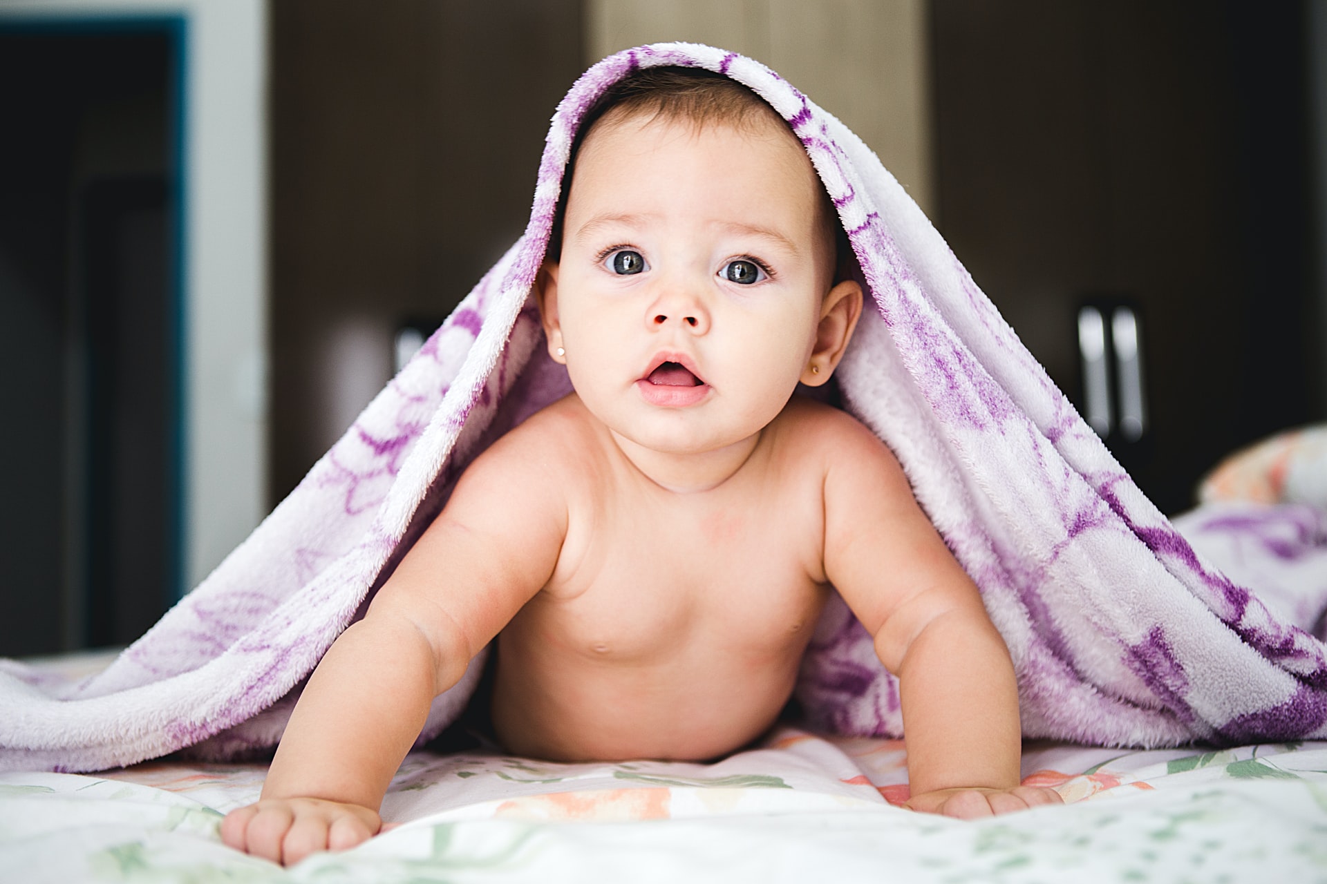 About Mommy Medicine, baby under purple blanket