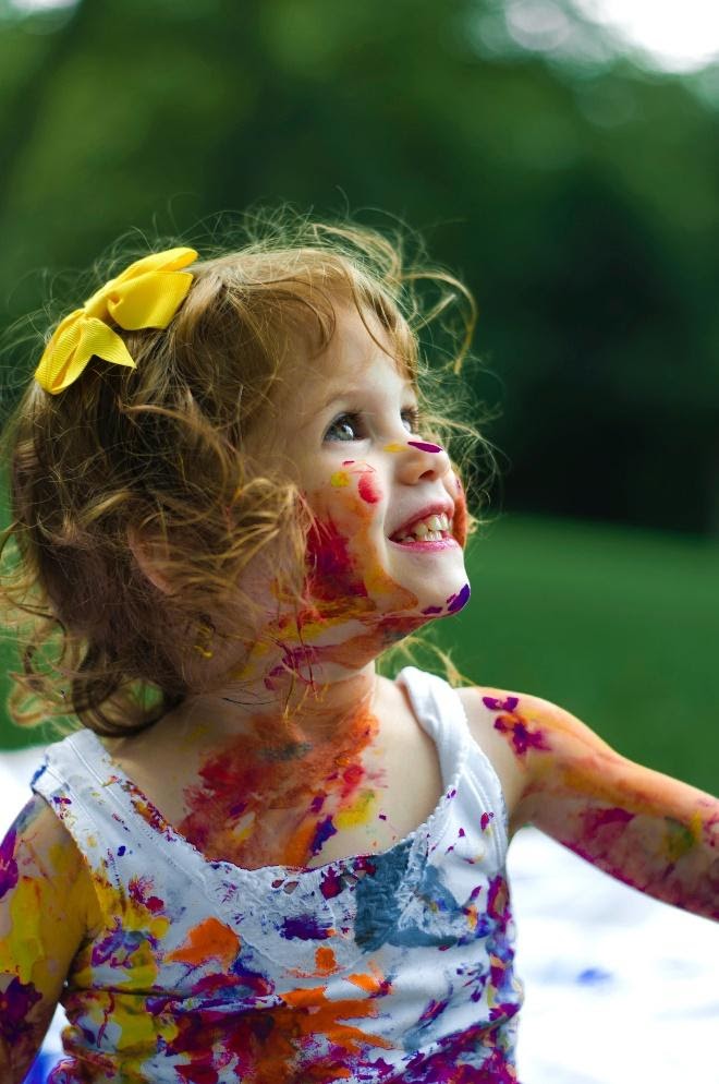 manage toddlers during coronavirus -girl similing with paint on face